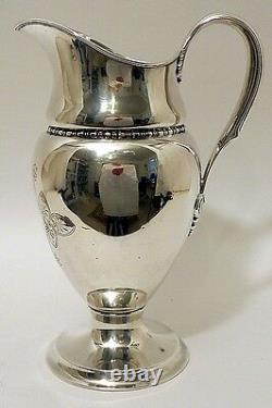 A tall sterling silver water pitcher, Tiffany & Co, New York, c. 1902-7