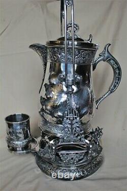 American Victorian SP Tilting Ice Water Pitcher On Frame -Wilcox Silver Plate Co