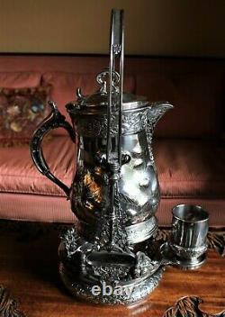 American Victorian SP Tilting Ice Water Pitcher On Frame -Wilcox Silver Plate Co