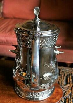 American Victorian SP Tilting Ice Water Pitcher On Frame -Wilcox Silver Plate Co