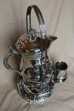 American Victorian SP Tilting Ice Water Pitcher On Frame -Wilcox Silver Plate Co