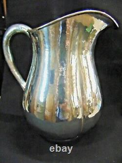Sterling Silver Arts and Crafts Water Pitcher by Lewy Bros. Hand Hammered