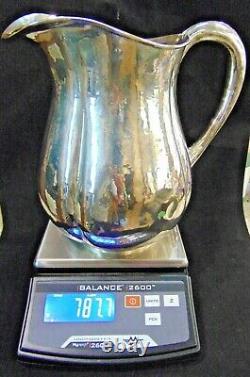 Sterling Silver Arts and Crafts Water Pitcher by Lewy Bros. Hand Hammered