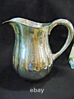 Sterling Silver Arts and Crafts Water Pitcher by Lewy Bros. Hand Hammered