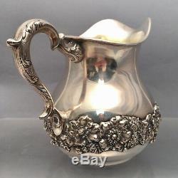 Sterling Water Pitcher With Floral Decoration by Hamilton & Diesinger