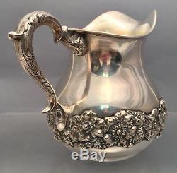 Sterling Water Pitcher With Floral Decoration by Hamilton & Diesinger