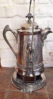 Victorian silver tilting water urn