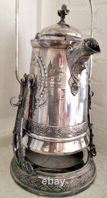 Victorian silver tilting water urn