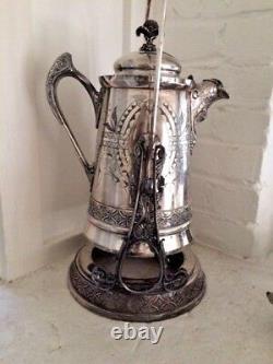 Victorian silver tilting water urn