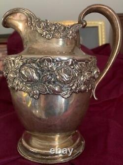 Vintage Sterling Water Pitcher. Rose highly collectible