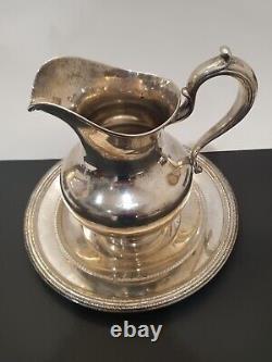 Whiting sterling water pitcher and Reed &Barton sterling platter
