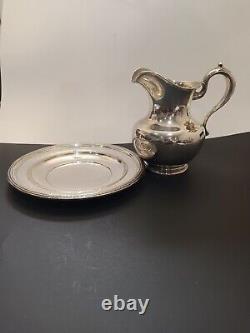 Whiting sterling water pitcher and Reed &Barton sterling platter