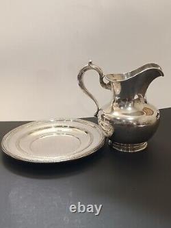 Whiting sterling water pitcher and Reed &Barton sterling platter